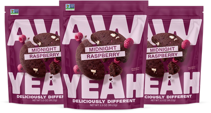 three packages gluten free non GMO dairy free cookies Purple package of AW Yeah Midnight Raspberry cookies